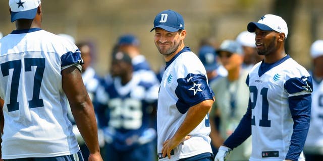 Dallas Cowboys quarterback Tony Romo (9) reacts after a botched play during the team's NFL football training camp, Thursday, July 30, 2015, in Oxnard, Calif. (AP Photo/Gus Ruelas)