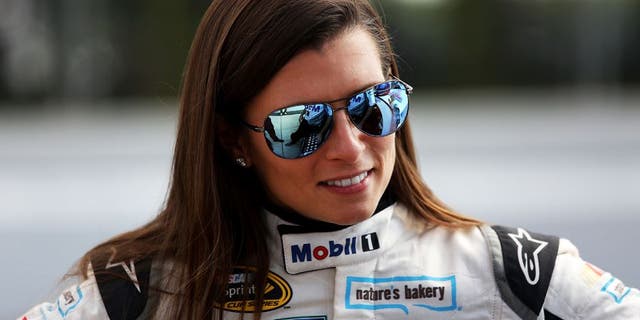 LONG POND, PA - JULY 29: Danica Patrick, driver of the #10 Mobil 1 Chevrolet, stands on the grid during qualifying for the NASCAR Sprint Cup Series Pennsylvania 400 at Pocono Raceway on July 29, 2016 in Long Pond, Pennsylvania. (Photo by Adam Glanzman/Getty Images)