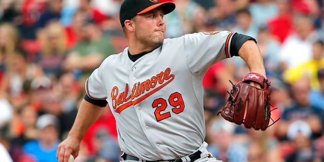 BOSTON, MA - JUNE 25: Tommy Hunter #29 of the Baltimore Orioles pitches against the Boston Red Sox during the ninth inning in a game at Fenway Park on June 25, 2015 in Boston, Massachusetts. (Photo by Winslow Townson/Getty Images)