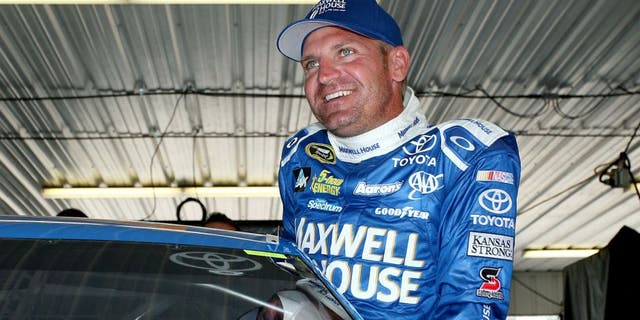 LONG POND, PA - JULY 31: Clint Bowyer, driver of the #15 Maxwell House Toyota, gets in his car in the garage during practice for the NASCAR Sprint Cup Series Windows 10 400 at Pocono Raceway on July 31, 2015 in Long Pond, Pennsylvania. (Photo by Tim Bradbury/Getty Images)