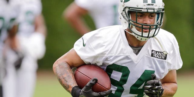 New York Jets wide receiver Devin Smith (84) runs after making a catch at NFL football training camp, Thursday, July 30, 2015, in Florham Park, N.J. (AP Photo/Frank Franklin II)