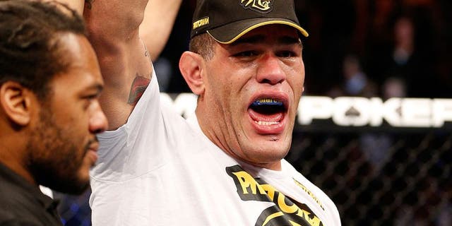 LAS VEGAS, NV - FEBRUARY 02: (R-L) Antonio Silva reacts to his knockout victory over Alistair Overeem after their heavyweight fight at UFC 156 on February 2, 2013 at the Mandalay Bay Events Center in Las Vegas, Nevada. (Photo by Josh Hedges/Zuffa LLC/Zuffa LLC via Getty Images)