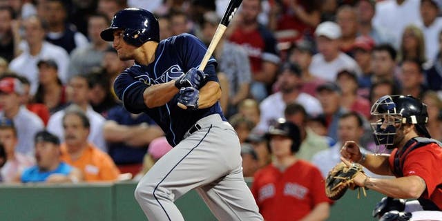 Jul 31, 2015; Boston, MA, USA; Tampa Bay Rays left fielder Mikie Mahtook (27) hits an RBI single during the third inning against the Boston Red Sox at Fenway Park. Mandatory Credit: Bob DeChiara-USA TODAY Sports