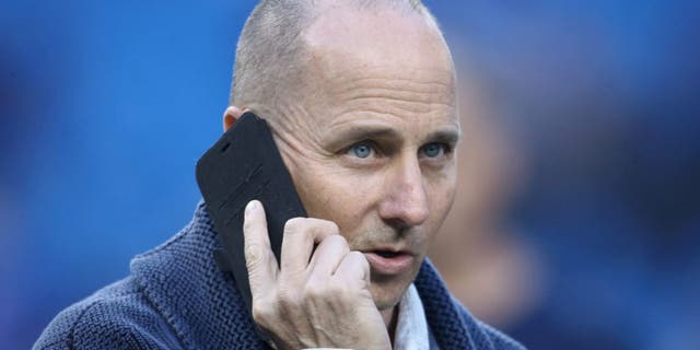 TORONTO, CANADA - SEPTEMBER 21: General manager Brian Cashman of the New York Yankees talks on the phone during batting practice before the start of MLB game action against the Toronto Blue Jays on September 21, 2015 at Rogers Centre in Toronto, Ontario, Canada. (Photo by Tom Szczerbowski/Getty Images)