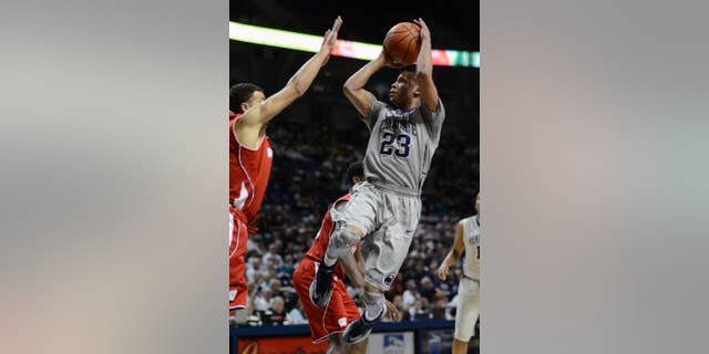 Penn State's Tim Frazier (23) looks for a shot during the first half of an NCAA college basketball game against Wisconsin, Sunday, March 2, 2014 in State College, Pa. (AP Photo/Ralph Wilson)