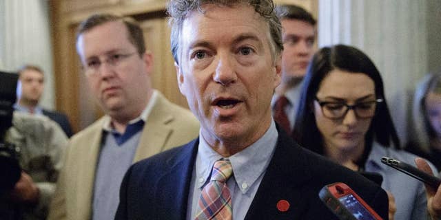 FILE - In this April 7, 2017, file photo, Sen. Rand Paul, R-Ky., speaks to reporters on Capitol Hill in Washington. Paul and Sen. Ron Wyden, D-Ore., are asking the nation’s top intelligence official to release more information about the communications of American citizens swept up in surveillance operations. (AP Photo/J. Scott Applewhite, file)