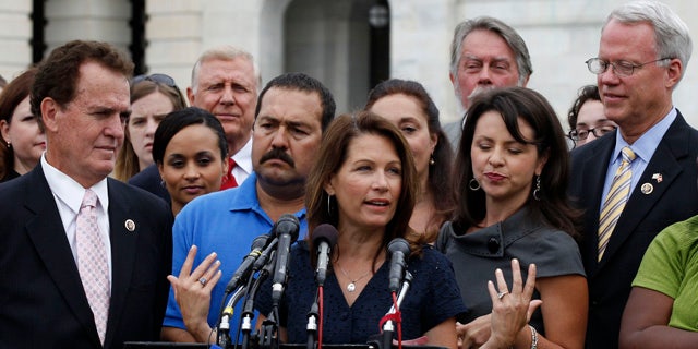July 21: Tea Party caucus leader Rep. Michele Bachmann, R-Minn., center, speaks at a news conference on Capitol Hill in Washington.