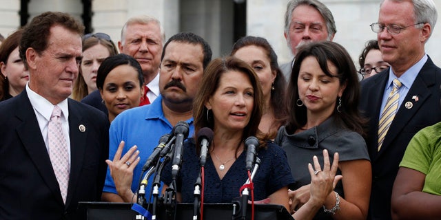 July 21: Tea Party caucus leader Rep. Michele Bachmann, R-Minn., center, speaks at a news conference on Capitol Hill in Washington.