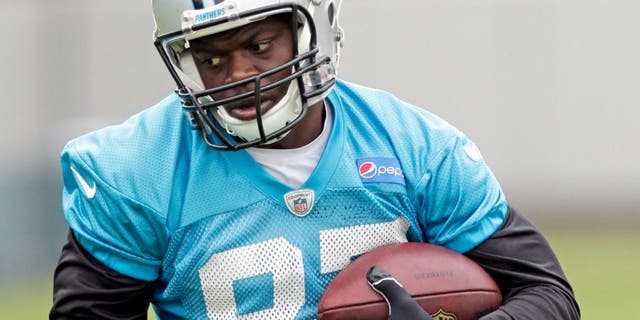 In this June 4, 2015, photo Carolina Panthers' Stephen Hill runs after a catch during an NFL football organized team activity in Charlotte, N.C. Hill has been cited for knowingly possessing drug paraphernalia with intent to use. Concord Police Department records indicate Hill was cited Tuesday near Charlotte Motor Speedway for possessing two grinders with marijuana residue and a marijuana bowl used to process, prepare and store. Panthers players are scheduled to arrive for training camp on Thursday. (AP Photo/Chuck Burton)
