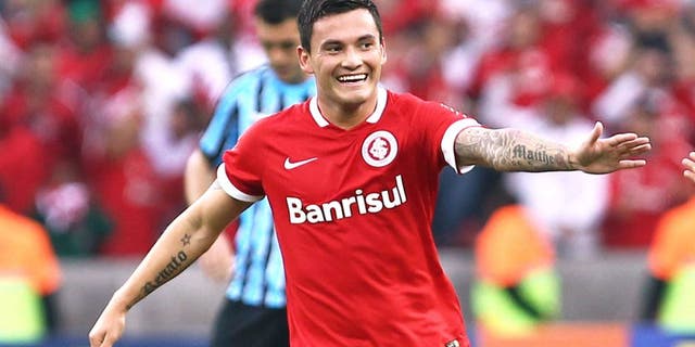 PORTO ALEGRE, BRAZIL - AUGUST 10: Charles Aranguiz, of Internacional celebrates their first goal during the match between Internacional and Gremio as part of Brasileirao Series A 2014, at Estadio Beira-Rio on August 10, 2014, in Porto Alegre, Brazil. (Photo by Lucas Uebel/Getty Images)