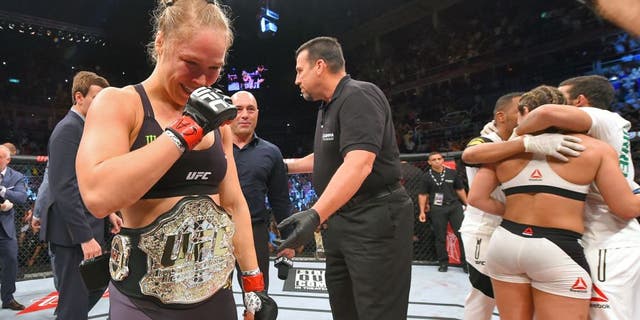 RIO DE JANEIRO, BRAZIL - AUGUST 01: (L-R) Ronda Rousey of the United States celebrates her knock out victory over Bethe Correia of Brazil in the first round in their UFC women's bantamweight championship bout during the UFC 190 event inside HSBC Arena on August 1, 2015 in Rio de Janeiro, Brazil. (Photo by Josh Hedges/Zuffa LLC/Zuffa LLC via Getty Images)