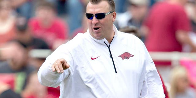 FAYETTEVILLE, ARKANSAS - APRIL 26: Head Coach Bret Bielema of the Arkansas Razorbacks watches his team warm up before the Red White Spring Football game at Razorback Stadium on April 26, 2014 in Fayetteville, Arkansas. (Photo by Wesley Hitt/Getty Images)
