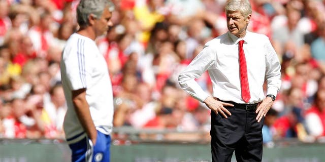 Football - Chelsea v Arsenal - FA Community Shield - Wembley Stadium - 2/8/15 Arsenal manager Arsene Wenger and Chelsea manager Jose Mourinho (L) Action Images via Reuters / Andrew Couldridge Livepic EDITORIAL USE ONLY. No use with unauthorized audio, video, data, fixture lists, club/league logos or "live" services. Online in-match use limited to 45 images, no video emulation. No use in betting, games or single club/league/player publications. Please contact your account representative for further details.