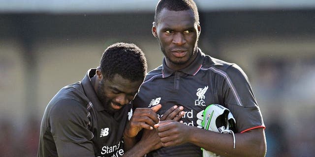 SWINDON, ENGLAND - AUGUST 02: (THE SUN OUT, THE SUN ON SUNDAY OUT) Christian Benteke and Kolo Toure of Liverpool show their appreciation to the fans at the end of a preseason friendly at County Ground on August 2, 2015 in Swindon, England. (Photo by Andrew Powell/Liverpool FC via Getty Images)