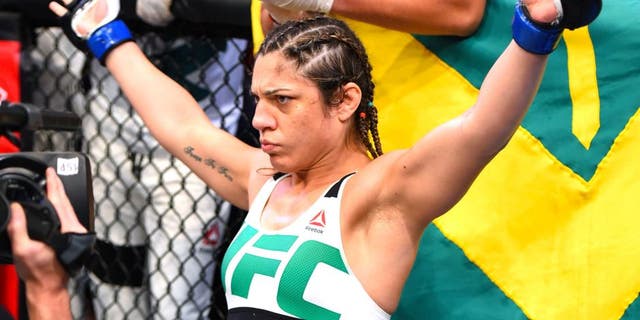 RIO DE JANEIRO, BRAZIL - AUGUST 01: Bethe Correia of Brazil enters the Octagon before facing Ronda Rousey of the United States in their UFC women's bantamweight championship bout during the UFC 190 event inside HSBC Arena on August 1, 2015 in Rio de Janeiro, Brazil. (Photo by Josh Hedges/Zuffa LLC/Zuffa LLC via Getty Images)