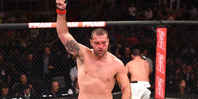 RIO DE JANEIRO, BRAZIL - AUGUST 01: (L-R) Mauricio 'Shogun' Rua of Brazil celebrates his victory over Rogerio Nogueira of Brazil in their light heavyweight bout during the UFC 190 event inside HSBC Arena on August 1, 2015 in Rio de Janeiro, Brazil. (Photo by Josh Hedges/Zuffa LLC/Zuffa LLC via Getty Images)