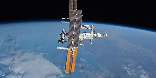 July 19: The International Space Station, photographed from the space shuttle Atlantis as the orbiting complex and the shuttle performed their relative separation.