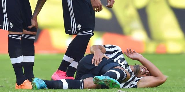 MARSEILLE, FRANCE - AUGUST 01: Sami Khedira (C) of Juventus FC lies injured during the preseason friendly match between Olympique de Marseille and Juventus FC at Stade Velodrome on August 1, 2015 in Marseille, France. (Photo by Valerio Pennicino/Getty Images)