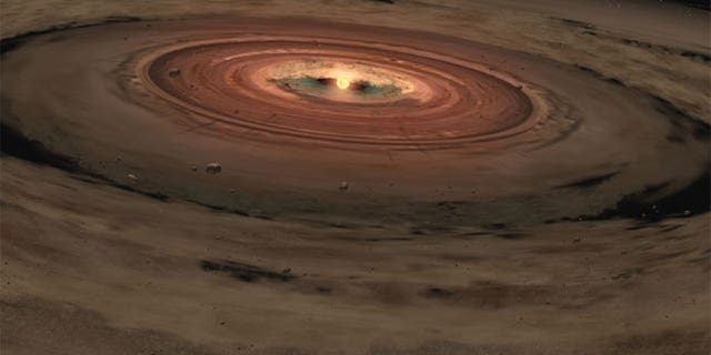 This artist's illustration shows a very young star surrounded by a disk of gas and dust, the raw materials from which rocky planets such as Earth form.