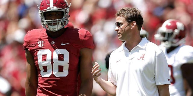 TUSCALOOSA, AL - APRIL 19: Offensive coordinator Lane Kiffin of the Alabama Crimson Tide speaks with O.J. Howard #88 of the Crimson team during the University of Alabama A-Day spring game at Bryant-Denny Stadium on April 19, 2014 in Tuscaloosa, Alabama. (Photo by Stacy Revere/Getty Images)