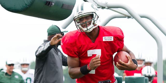 Aug 4, 2014; Cortland, NY, USA; New York Jets quarterback Geno Smith (7) runs with the ball during drills at training camp at SUNY Cortland. Mandatory Credit: Rich Barnes-USA TODAY Sports
