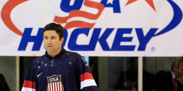 Former NHL player and Olympic team member Chris Drury walks onto the ice in 2013, in preparation for the 2014 Winter Olympics. NHL stars will not participate in the 2018 Games.