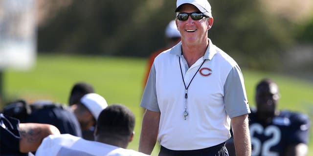 Chicago Bears head coach John Fox smiles as he watches his team during NFL football training camp at Olivet Nazarene University, Saturday, Aug. 1, 2015, in Bourbonnais, Ill. (AP Photo/Nam Y. Huh)