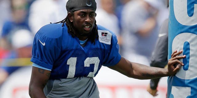 Indianapolis Colts wide receiver T.Y. Hilton (13) stretches during NFL football training camp in Anderson, Ind., Tuesday, Aug. 4, 2015. (AP Photo/Michael Conroy)