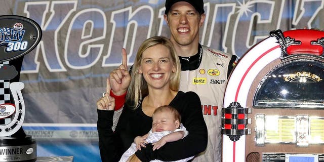 SPARTA, KY - JULY 10: Brad Keselowski, driver of the #22 Discount Tire Ford, poses with girlfriend Paige White and their daughter in Victory Lane after winning the NASCAR XFINITY Series Kentucky 300 at Kentucky Speedway on July 10, 2015 in Sparta, Kentucky. (Photo by Sean Gardner/NASCAR via Getty Images)