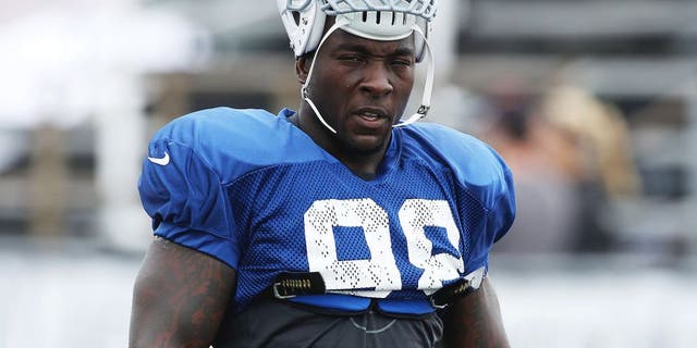 Jul 31, 2013; Indianapolis, IN, USA; Indianapolis Colts linebacker Robert Mathis (98) walks across the field to head to his workout area during training camp at Anderson University. Mandatory Credit: Brian Spurlock-USA TODAY Sports