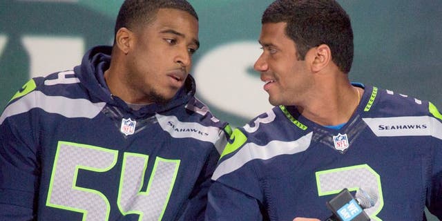 SEATTLE, WA - MARCH 21: (L-R) Super Bowl Champion Seattle Seahawks NFL players Bobby Wagner and Russell Wilson speak on on stage during We Day at Key Arena on March 21, 2014 in Seattle, Washington. (Photo by Mat Hayward/Getty Images)