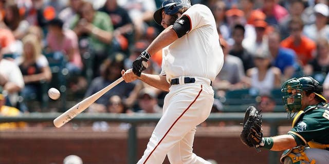 SAN FRANCISCO, CA - JULY 25: Madison Bumgarner #40 of the San Francisco Giants hits a solo home run in the third inning against the Oakland Athletics at AT&T Park on July 25, 2015 in San Francisco, California. (Photo by Lachlan Cunningham/Getty Images)