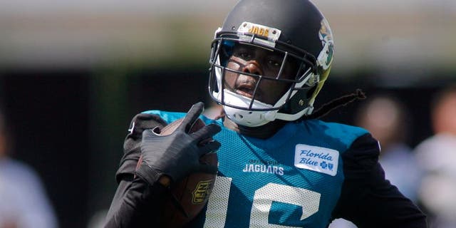 Jul 25, 2014; Jacksonville, FL, USA; Jacksonville Jaguars wide receiver Denard Robinson (16) runs with the ball during the first day of training camp at Florida Blue Health and Wellness Practice Fields. Mandatory Credit: Phil Sears-USA TODAY Sports