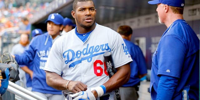 NEW YORK, NY - JULY 24: (NEW YORK DAILIES OUT) Yasiel Puig #66 of the Los Angeles Dodgers looks on against the New York Mets at Citi Field on July 24, 2015 in the Flushing neighborhood of the Queens borough of New York City. The Dodgers defeated the Mets 7-2. (Photo by Jim McIsaac/Getty Images)