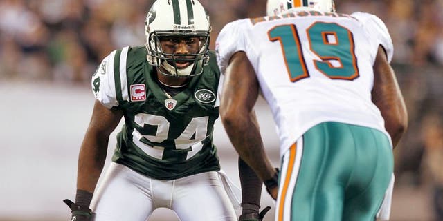 EAST RUTHERFORD, NJ - OCTOBER 17: (NEW YORK DAILIES OUT) Darrelle Revis #24 of the New York Jets defends against Brandon Marshall #19 of the Miami Dolphins on October 17, 2011 at MetLife Stadium in East Rutherford, New Jersey. The Jets defeated the Dolphins 24-6.. (Photo by Jim McIsaac/Getty Images)