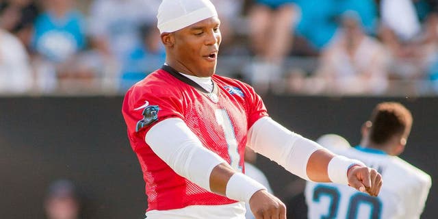 Jul 31, 2015; Spartanburg, SC, USA; Carolina Panthers quarterback Cam Newton (1) dances while stretching during training camp held at Wofford College. Mandatory Credit: Jeremy Brevard-USA TODAY Sports