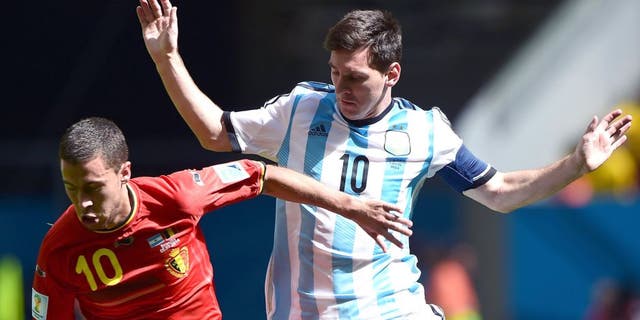 Belgium's midfielder Eden Hazard (L) vies with Argentina's forward Lionel Messi during the second half of a quarter-final football match between Argentina and Belgium at the Mane Garrincha National Stadium in Brasilia during the 2014 FIFA World Cup on July 5, 2014. AFP PHOTO / FRANCOIS XAVIER MARIT (Photo credit should read FRANCOIS XAVIER MARIT/AFP/Getty Images)