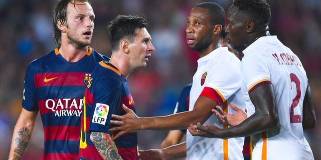BARCELONA, SPAIN - AUGUST 05: Lionel Messi of FC Barcelona argues with Yanga-M'Biwa (R) of AS Romaduring the Joan Gamper trophy match at Camp Nou on August 5, 2015 in Barcelona, Spain. (Photo by David Ramos/Getty Images)