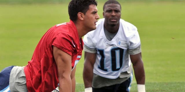 May 26, 2015; Nashville, TN, USA; Tennessee Titans first round draft pick quarterback Marcus Mariota (8) works out with titans wide receiver Jacoby Ford (10) during OTA at Saint Thomas Sports Park. Mandatory Credit: Jim Brown-USA TODAY Sports