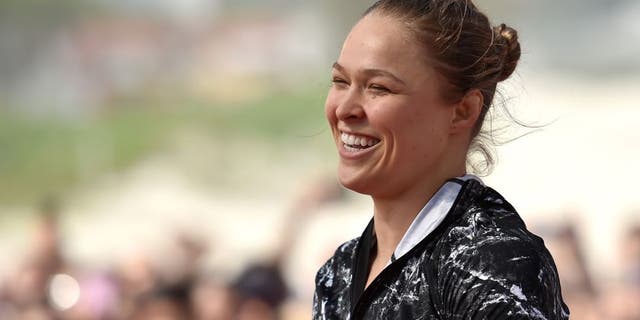 RIO DE JANEIRO, BRAZIL - JULY 29: Womens bantamweight champion Ronda Rousey of the United States smiles during open training session at Pepe Beach on July 29, 2015 in Rio de Janeiro, Brazil. (Photo by Buda Mendes/Zuffa LLC/Zuffa LLC via Getty Images)