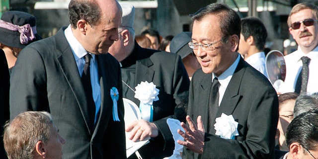 Aug. 6: In this photo provided by the City of Hiroshima, U.S. Ambassador to Japan John Roos, center left, greets Hiroshima city's Mayor Tadatoshi Akiba on his arrival at the Hiroshima Peace Memorial Park to attend the 65th anniversary of the world's first atomic bombing in Hiroshima. The United States sent its first ever delegation to the ceremony marking the anniversary of the attacks.