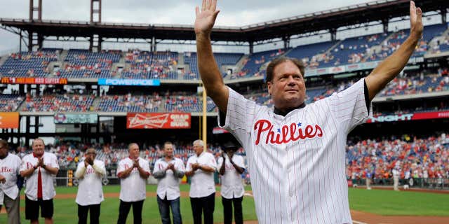 FILE- In this Aug 3, 2013, file photo, former Philadelphia Phillies catcher Darren Daulton waves to the crowd as he takes the field during the Philadelphia Phillies Alumni ceremonies before a baseball game against the Atlanta Braves in Philadelphia.