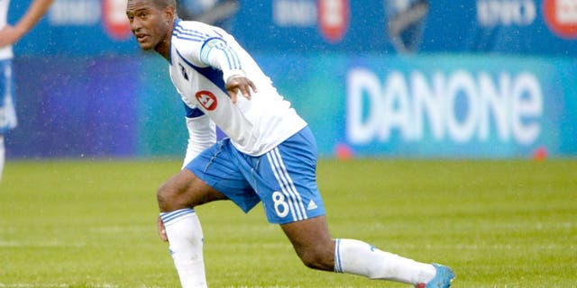 Apr 26, 2014; Montreal, Quebec, Canada; Montreal Impact midfielder Patrice Bernier (8) directs teammates during the first half against the Philadelphia Union at Stade Saputo. Mandatory Credit: Eric Bolte-USA TODAY Sports