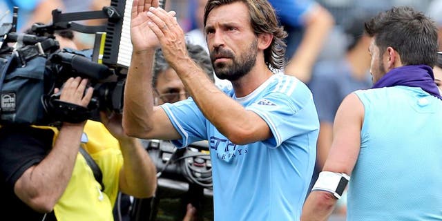 Jul 26, 2015; New York, NY, USA; New York City FC midfielder Andrea Pirlo (21) leaves the field after defeating the Orlando City FC in a soccer match at Yankee Stadium. The New York City FC won 5-3. Mandatory Credit: Adam Hunger-USA TODAY Sports