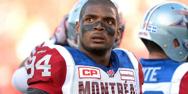 Montreal Alouettes' Michael Sam and teammates warm up for a Canadian Football League game against the Ottawa Redblacks in Ottawa, Ontario, on Friday, Aug. 7, 2015. (Justin Tang/The Canadian Press via AP)