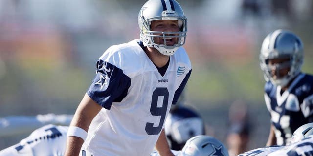 Aug 1, 2015; Oxnard, CA, USA; Dallas Cowboys quarterback Tony Romo (9) takes the snap at training camp at River Ridge Fields. Mandatory Credit: Kirby Lee-USA TODAY Sports