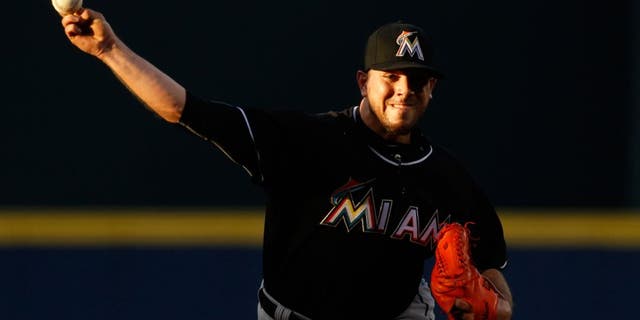 Miami Marlins starting pitcher Jose Fernandez throws during the first inning of the Marlins' baseball game against the Atlanta Braves, Friday, Aug. 7, 2015, in Atlanta. (AP Photo/Brett Davis)