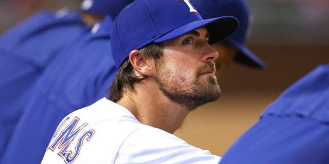 ARLINGTON, TX - JULY 31: Cole Hamels #35 of the Texas Rangers looks on as the Rangers take on the San Francisco Giants in the bottom of the eighth inning at Globe Life Park in Arlington on July 31, 2015 in Arlington, Texas. (Photo by Tom Pennington/Getty Images)