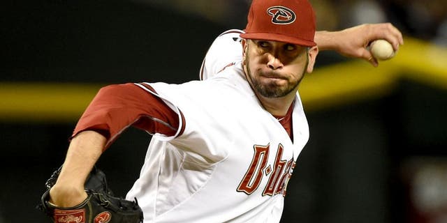 PHOENIX, AZ - JUNE 29: Oliver Perez #59 of the Arizona Diamondbacks delivers a pitch against the Los Angeles Dodgers at Chase Field on June 29, 2015 in Phoenix, Arizona. (Photo by Norm Hall/Getty Images)