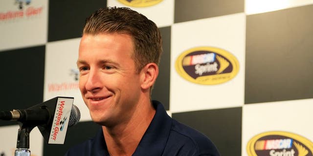 WATKINS GLEN, NY - AUGUST 07: AJ Allmendinger, driver of the #47 Kroger/Bush's Beans Chevrolet, speaks to the media during a press conference prior to practice for the NASCAR Sprint Cup Series Cheez-It 355 at Watkins Glen International on August 7, 2015 in Watkins Glen, New York. (Photo by Daniel Shirey/Getty Images)